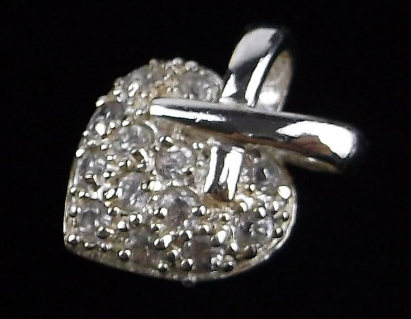 New Sterling Silver Heart Pendant: Solid Sterling Silver Guaranteed, in Brand New Never Worn Condition.