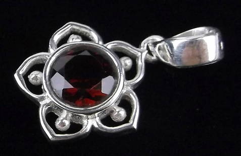 New Sterling Silver Garnet Blooming Lotus Pendant: Solid Sterling Silver Guaranteed, in Brand New Never Worn Condition.
