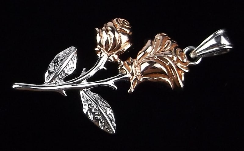 New Sterling Silver 10k Gold Rose Pendant: Solid Sterling Silver Guaranteed, in Brand New Never Worn Condition.