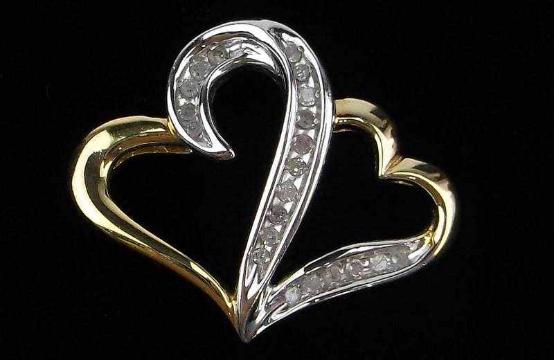 New Sterling Silver Diamond Double Heart Pendant: Solid Sterling Silver Guaranteed, in Brand New Never Worn Condition.