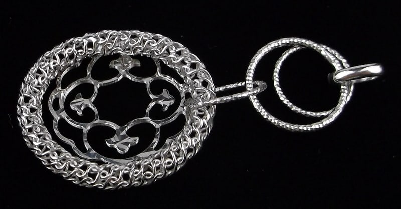 New Sterling Silver Designer Hoop Pendant: Solid Sterling Silver Guaranteed, in Brand New Never Worn Condition.