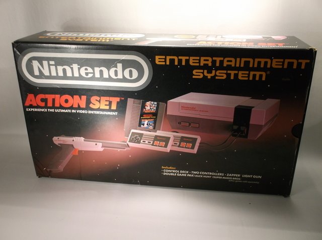 Vintage Original NES Nintendo System In Box: In Box With Carding Styrafome and bookelts. Contains the NES system, all hook ups, zapper gun, mario duck hunt game, and one controller. Nice Set