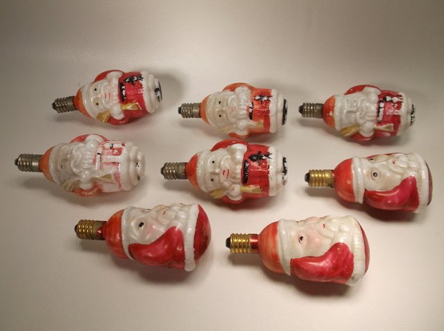 Antique Christmas Santa Claus Lights: some paint loss, but in nice condition no cracks breaks etc. They have not been tested to see if they work but when they were shaken there was no rattling or sounds to seem they were blown.