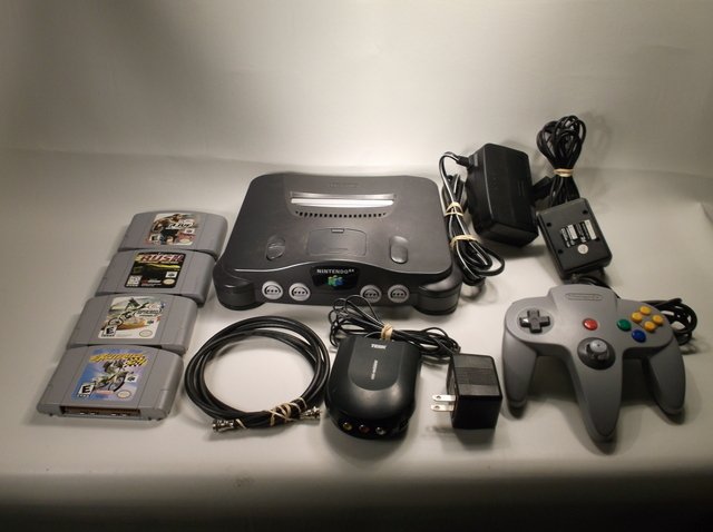 Nice Nintendo 64 Game Console Bundle: Nice nintendo 64 Game Console System Bundle with 4 games, ALL hook ups plus extras, and one controller. Works great, ready to GO!