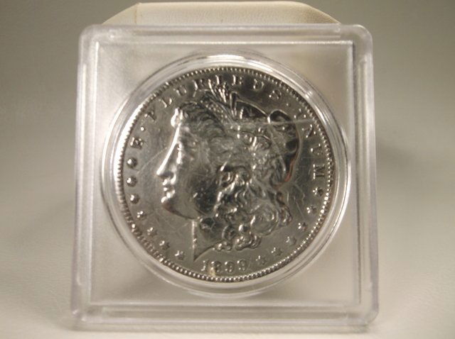 1899 O US Silver Morgan Dollar (1 of 2)