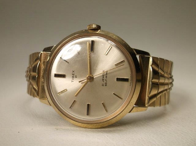 Gorgeous Antique 10kt GF Timex Wristwatch Read: Gorgeous Antique 10kt GF Timex Wristwatch with original band, seems to have never been worn, works and winds perfect, perfect condition, great watch