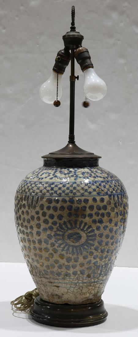 Early Persian pottery jar mounted as a lamp, having a (1 of 4)