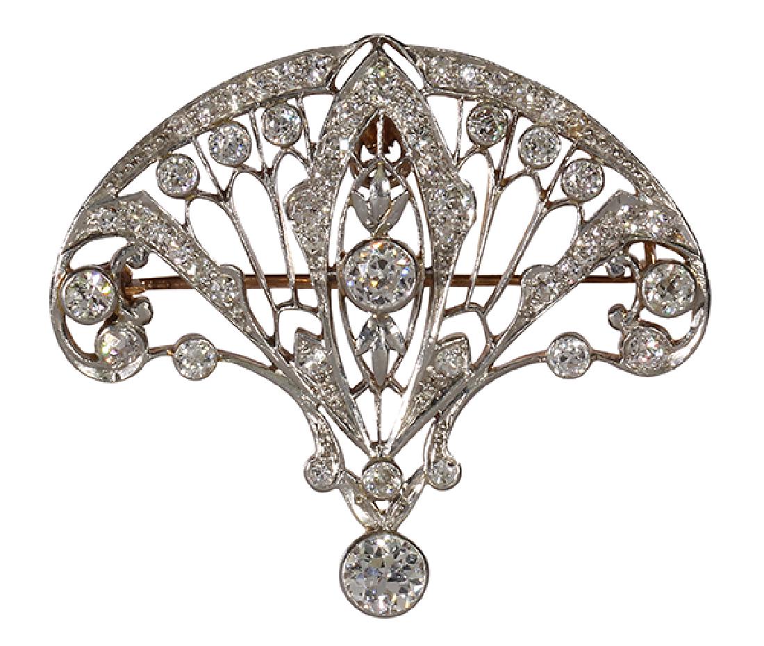 Edwardian diamond, platinum-topped 14k yellow gold: Edwardian diamond, platinum-topped 14k yellow gold pendant-brooch featuring (2) old European-cut diamonds, weighing a total of approximately 0.55 ct., accented by (52) old European and single-cut diam