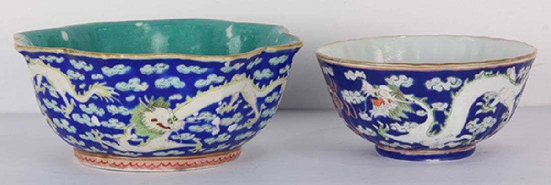 Two Chinese Porcelain Dragon Bowl/Cup: (lot of 2) Chinese enameled porcelain, consisting of two bowls one with foliate rim, each depicting meandering dragons on a blue ground, base with Tongzhi mark, largest: 5.75"w