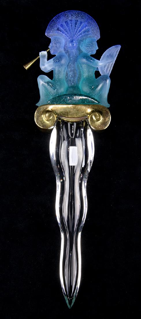 Daum France pate de verre letter opener, depicting: Daum France pate de verre letter opener depicting seated musicians flanking a palm or lotus pediment in blue and green glass having a brass grip with clear glass blade signed Daum France with original