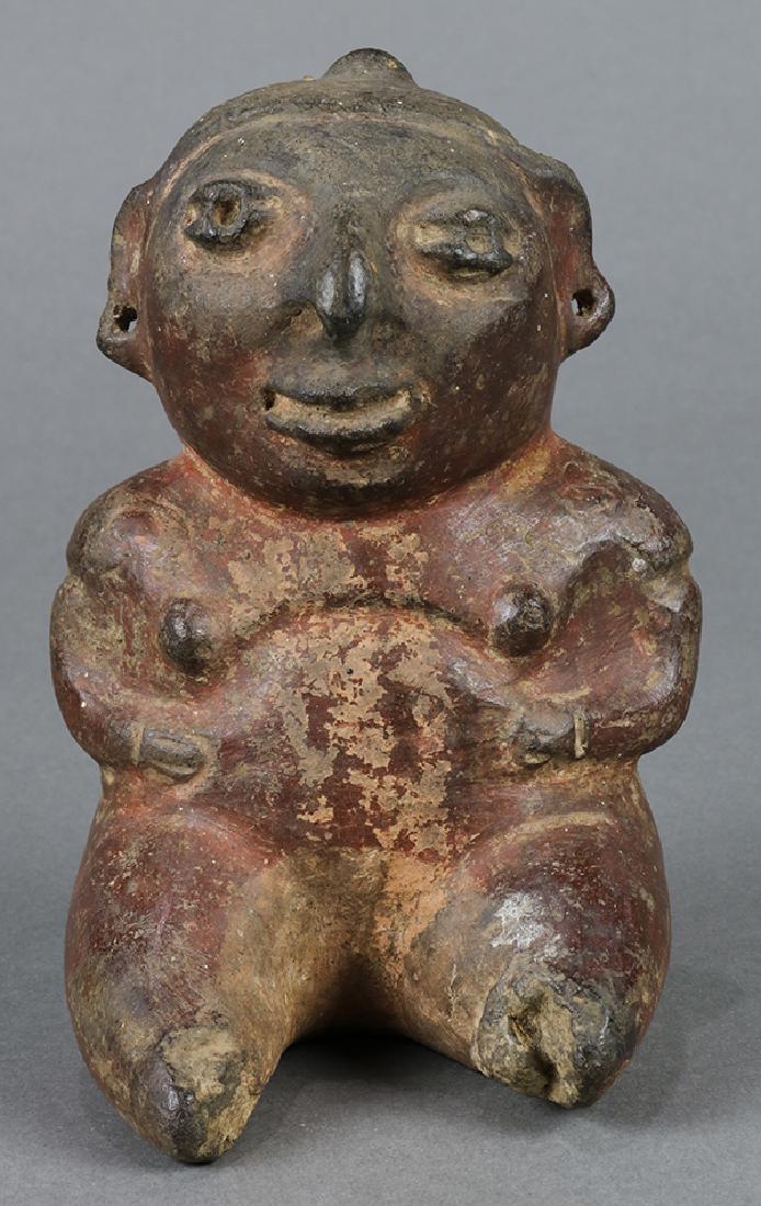 Pre-Columbian West Mexican figure seated with an (1 of 1)