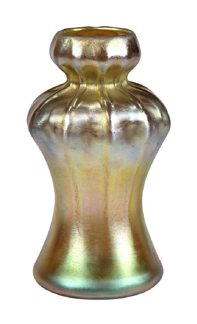 Tiffany Studios gold favrile vase: Tiffany Studios gold favrile vase, having a tapered body with ribbed and dimpled accents, signed and numbered on underside "L.C. Tiffany Favrile, 7904 C", drilled, 9"h