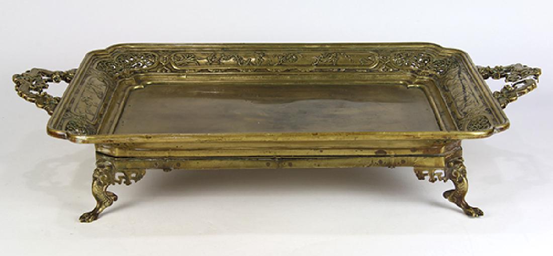Victorian Aesthetic style bronze footed tray: Victorian Aesthetic style bronze footed tray, having pierced designs with handled sides executed in the Asian taste, and rising on paw feet, 4.5"h x 26"w x 16"d