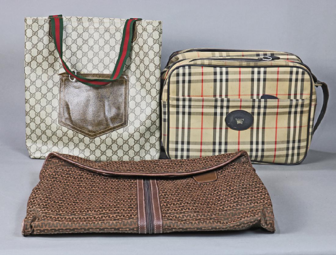 (lot of 3) Vintage purse group: (lot of 3) Vintage purse group, consisting of an overnight bag in plaid marked Burberry, a tote bag with mongrammed canvas marked Gucci, and a garment bag marked "Mark Cross, Italy"