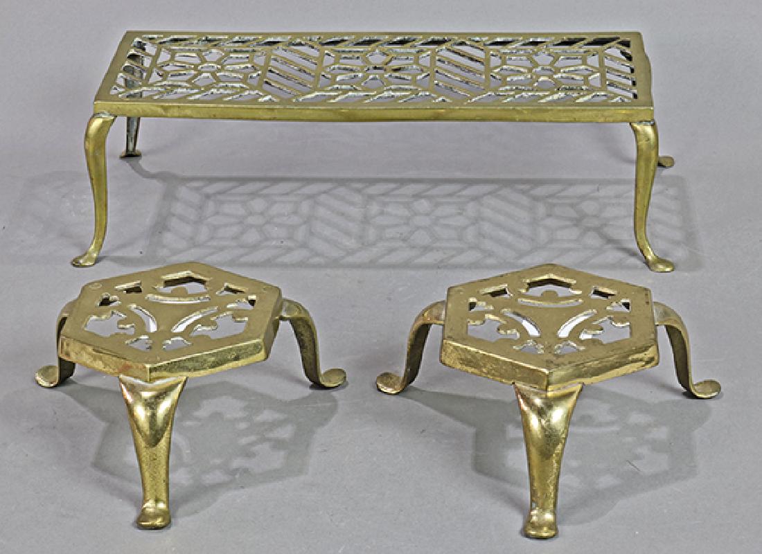 (lot of 3) English brass trivet group, each with a (1 of 1)