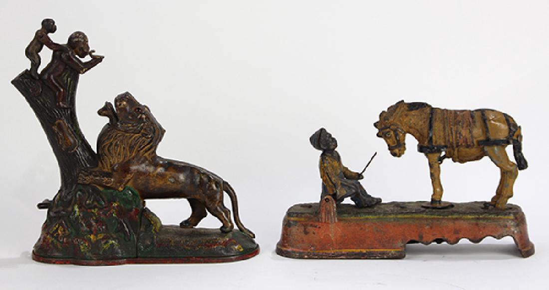 (lot of 2) Cold painted cast iron coin banks, one (1 of 4)