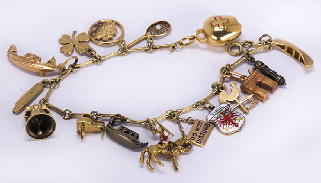 Yellow gold, silver and metal charm bracelet (1 of 4)