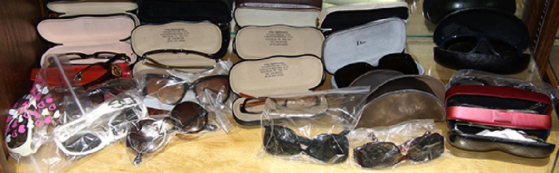 One shelf of fashion eyewear: One shelf of fashion eyewear, consisting of primarily Chanel examples, including eyeglasses and sunglasses with matching hardshell cases