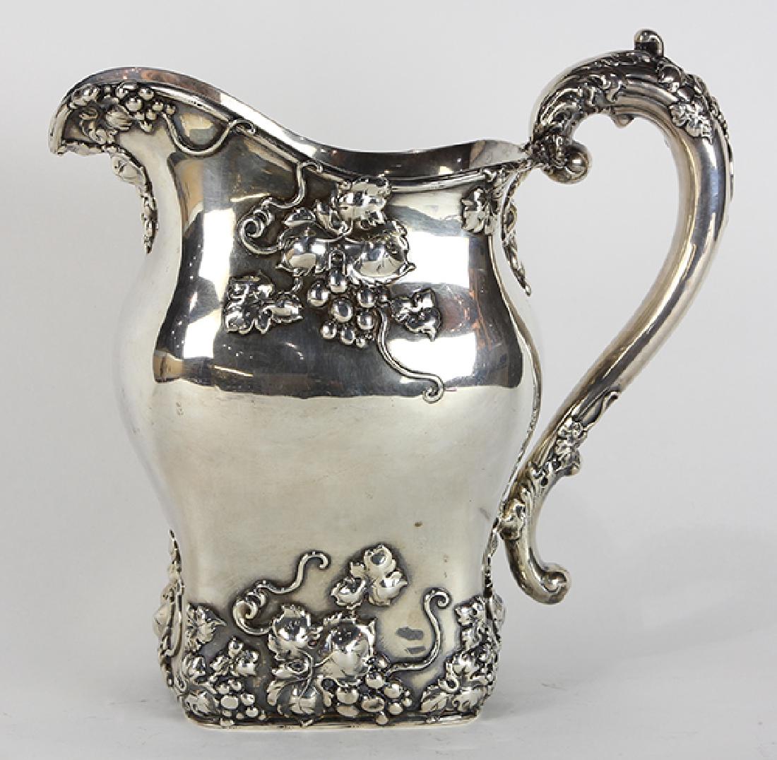 American sterling silver water pitcher, having a shaped (1 of 4)