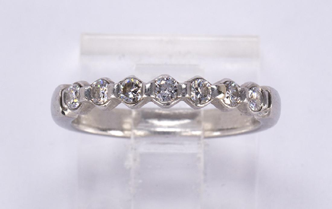Diamond and platinum band ring (1 of 4)
