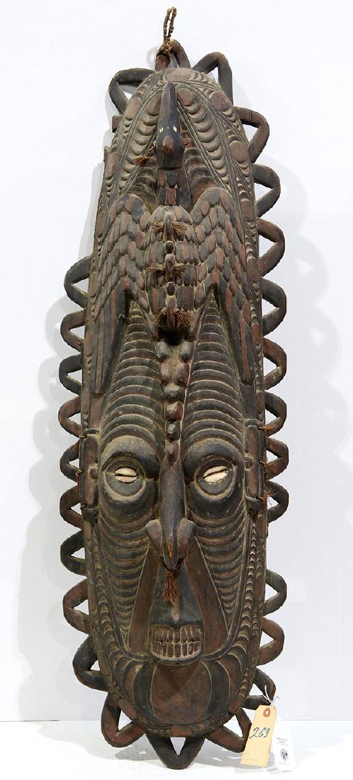Papau New Guinea carved wood mask, of oval form with (1 of 3)