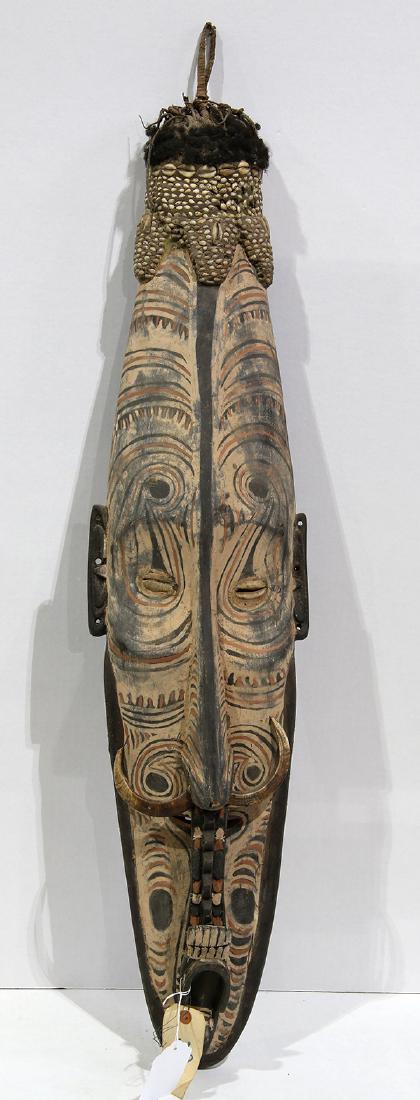 Papau New Guinea mwal mask, of oval form with polycrome (1 of 3)
