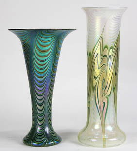 (lot of 2) Lundberg Studios irridescent art glass vases: (lot of 2) Lundberg Studios irridescent art glass vases, one having a trumpet form in green and blue with pulled designs, the other in white, gold and green, having a cylindrical standard with a circu