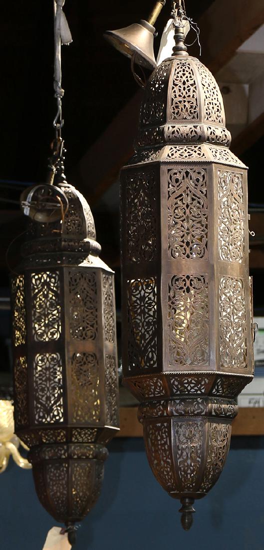Pair of Moorish hall lanterns: Pair of Moorish hall lanterns, each having a reticulated body with scroll and floral accents, 42"h x 10"w