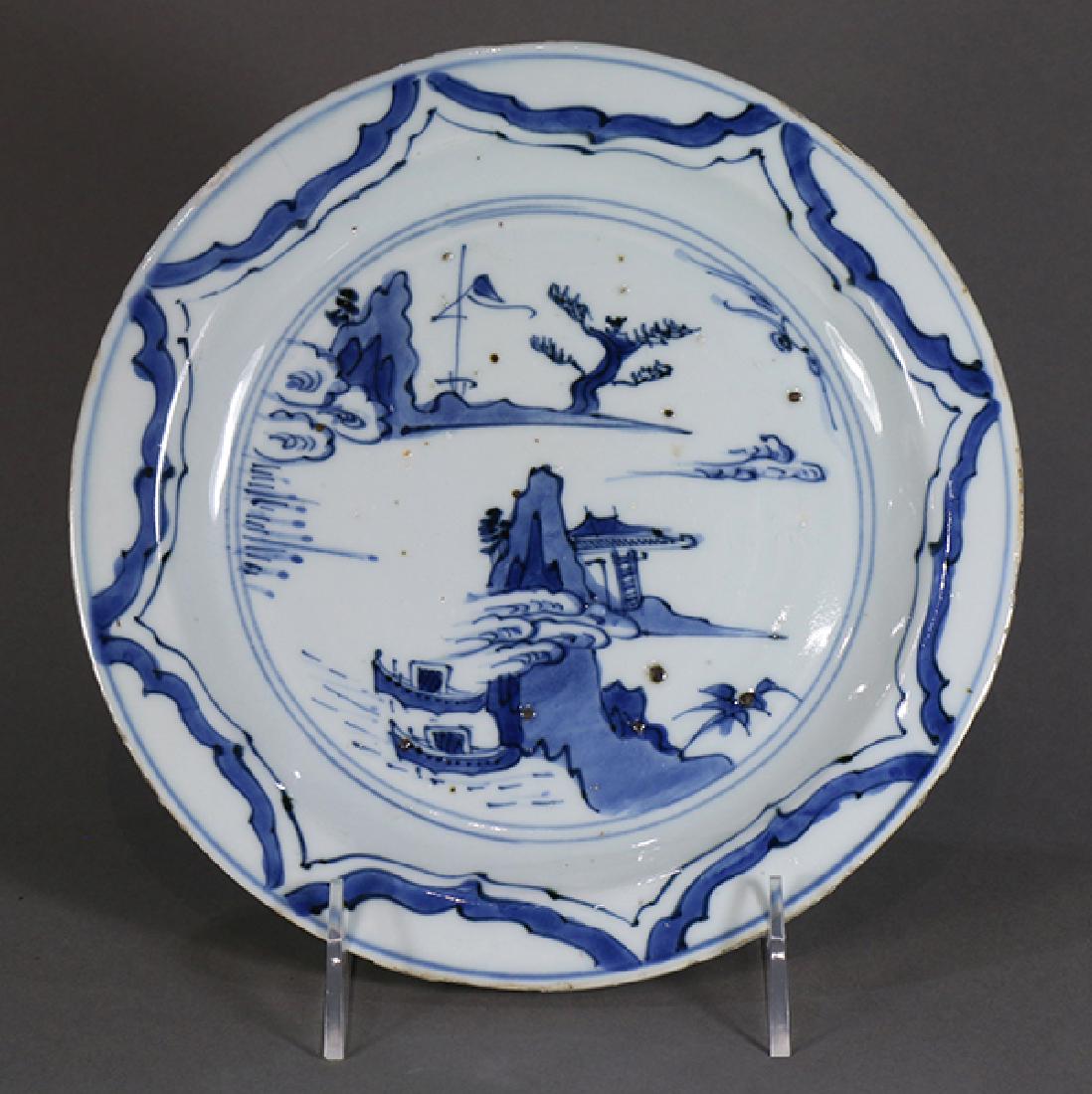Chinese Kosometsuke Plate, River Scene: Chinese underglazed blue porcelain plate, ko-sometsuke for the Japanese market, late Ming dynasty, the well decorated with a riverside scene, the everted rim with a sunburst pattern, 8"w