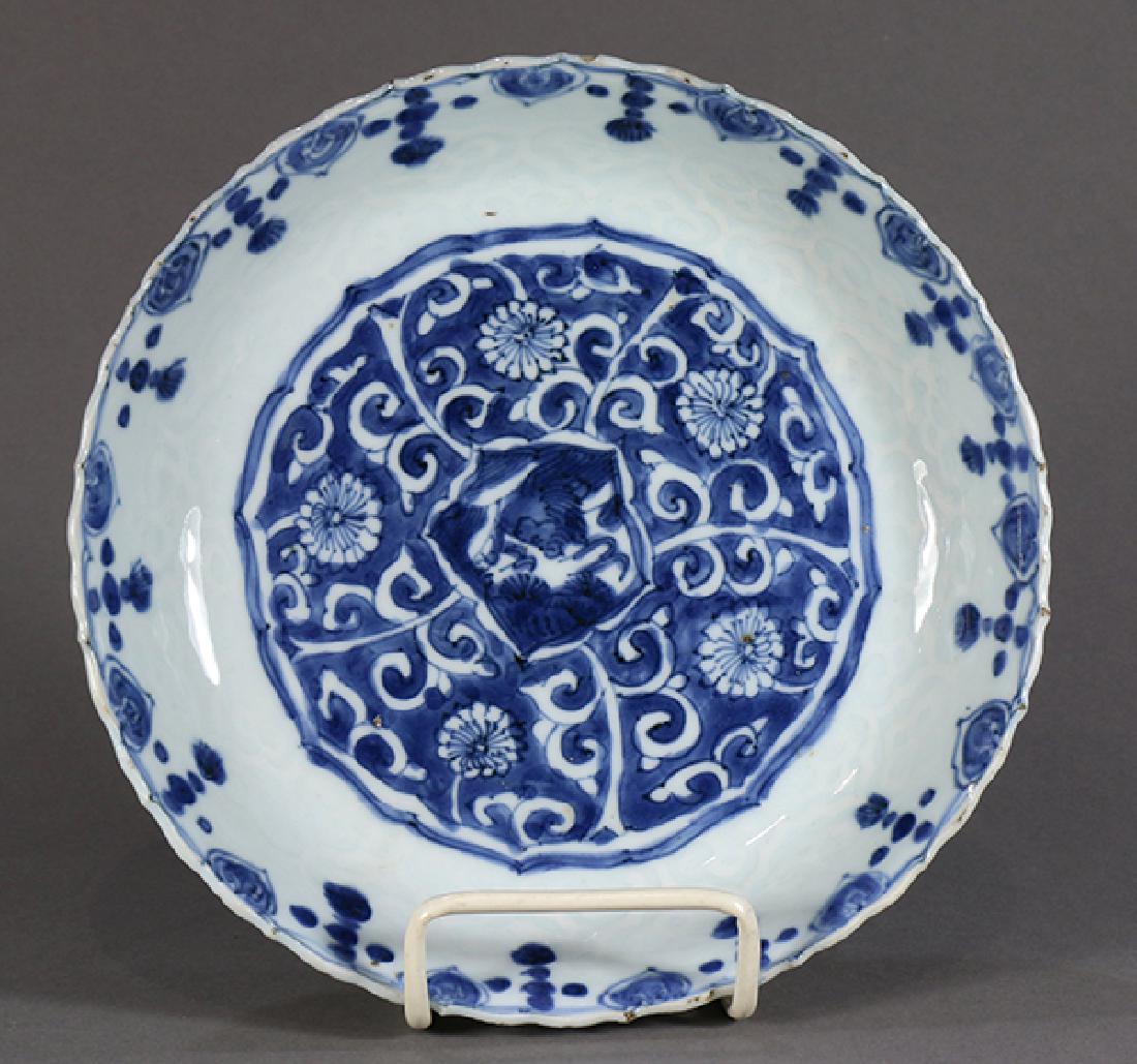 Chinese Blue and White Porcelain Plate, Flowers: Chinese underglaze blue porcelain plate, Ming dynasty, centered with a shaped reserve with floral scrolls, the wall molded with ruyi heads below the foliate rim accented by blue ruyi heads, 8"w