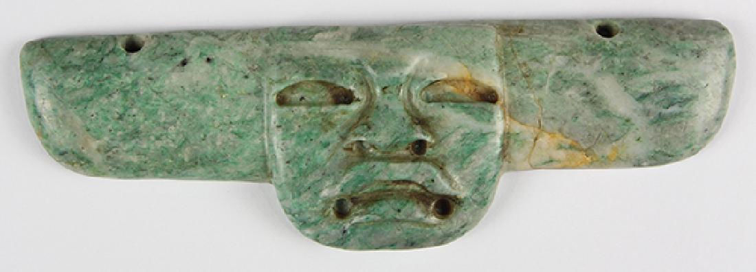 An Olmec-style jade pendant in a form perhaps based (1 of 2)