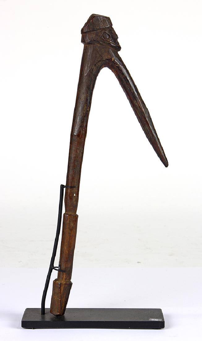 Massim Culture: Massim Culture, Papua New Guinea, figurative wood tool or utensil used for the mending of nets used to hunt pigs, 10"h Provenance: published in Michael Hamson's "Art of the Massim & Collingwood Bay" 2