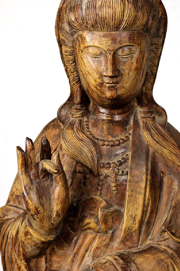 Chinese Wood Guanyin: Chinese wooden sculpture of Guanyin, the standing bodhisattva holding an amphora, accompanied by an attendant standing on a dragon, 38.5"h