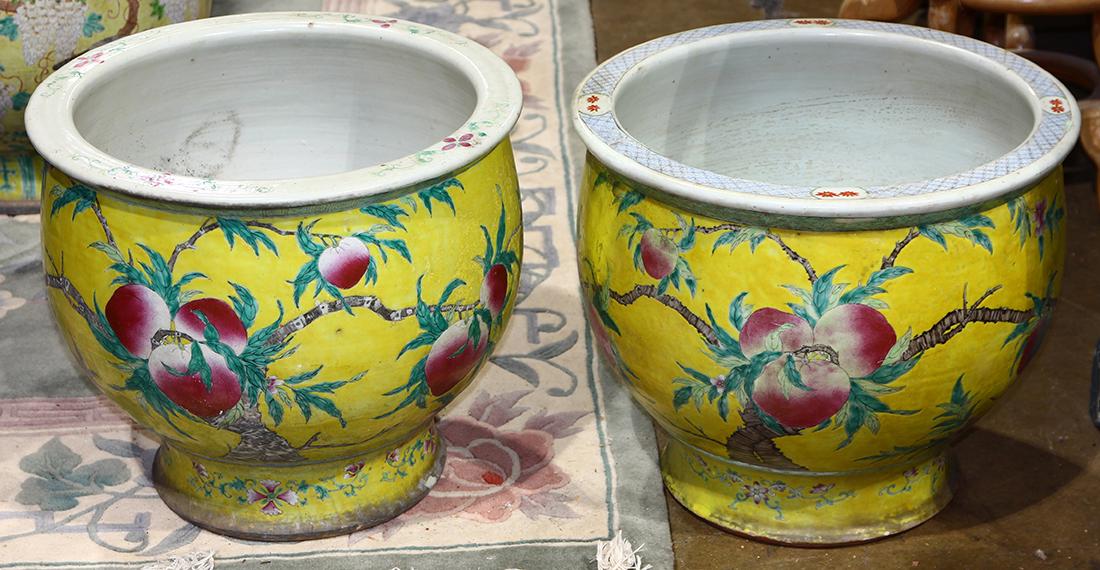Chinese Porcelain Planters, Peaches: (lot of 2) Chinese enameled porcelain planters, featuring branches with ripe peaches on a yellow ground (repaired), 16"h