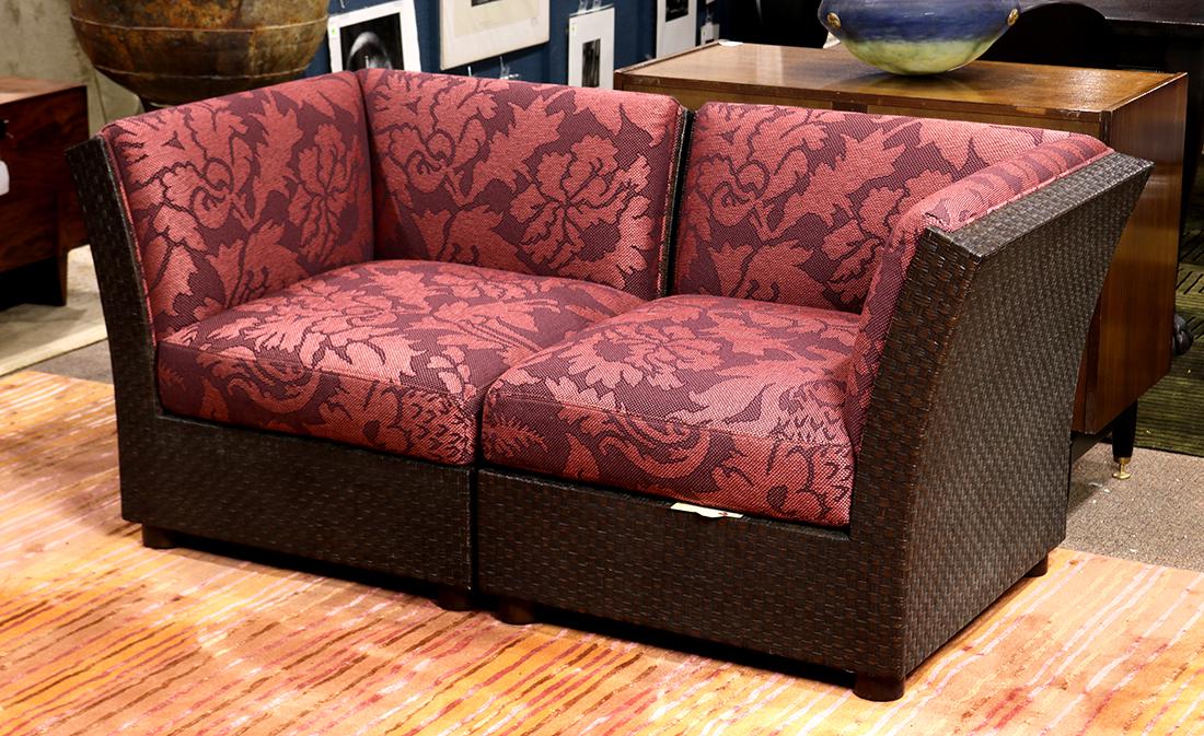 (lot of 2) Orlando Diaz-Azcuy for McGuire San Francisco: (lot of 2) Orlando Diaz-Azcuy for McGuire San Francisco corner chair sectionals, in two parts, having blush upholstery with stylized floral designs, above the mocha rattan frame, rising on cylindrical