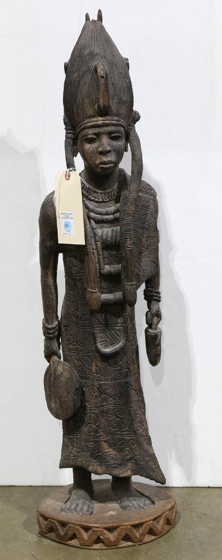 African ironwood carved figural group, depicting a (1 of 3)