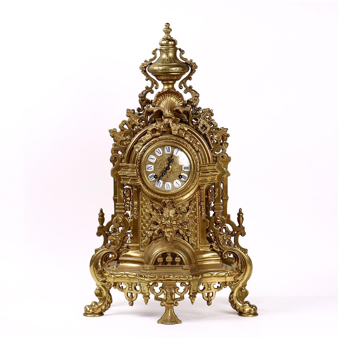 Rococo Revival style brass mantle clock, the round face (1 of 4)