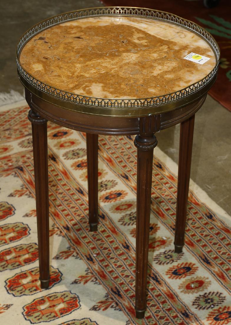 Louis XVI style gueridon: Louis XVI style gueridon, having a marble top with pierced brass gallery, and rising on four tapering legs, .5"h x 16.5"dia.