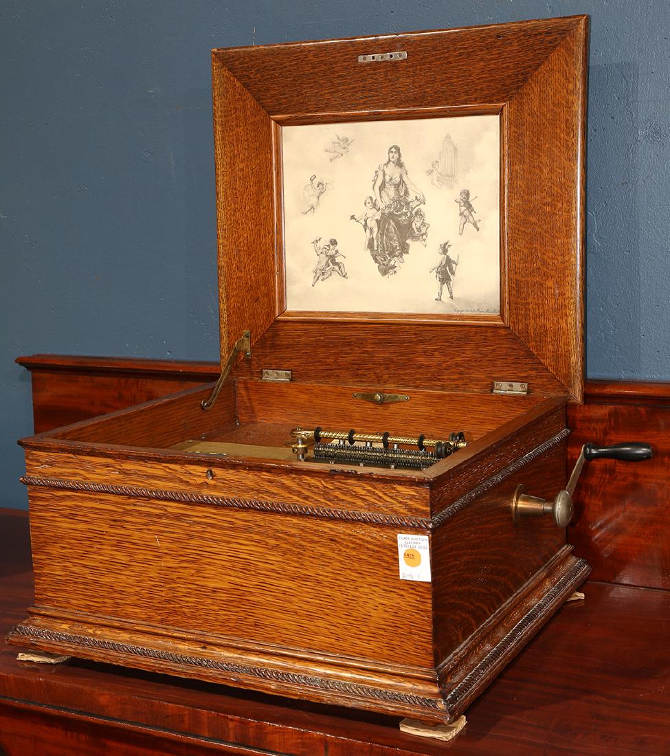 Victorian Regina music player, the oak case having a (1 of 3)