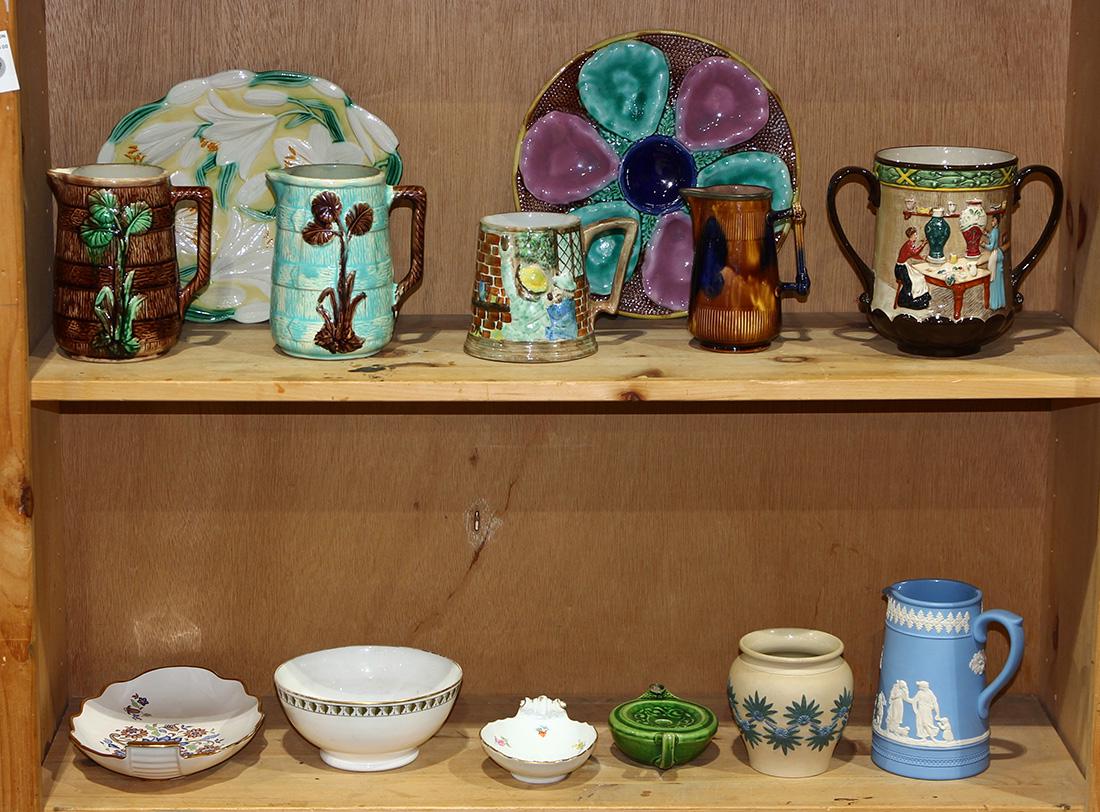 (lot of 13) Group of majolica including an oyster plate: (lot of 13) Group of majolica including an oyster plate, creamers, including examples having foliate decoration, a loving cup with a genre scene, a Meissen candy dish, etc. largest: 10"dia.