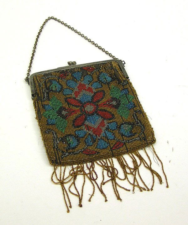 Vintage beaded purse: Vintage beaded purse, the insiced silver plated frame with chain handle supporting the multi color beaded purse with floral motif and beaded fringe, loss of beads