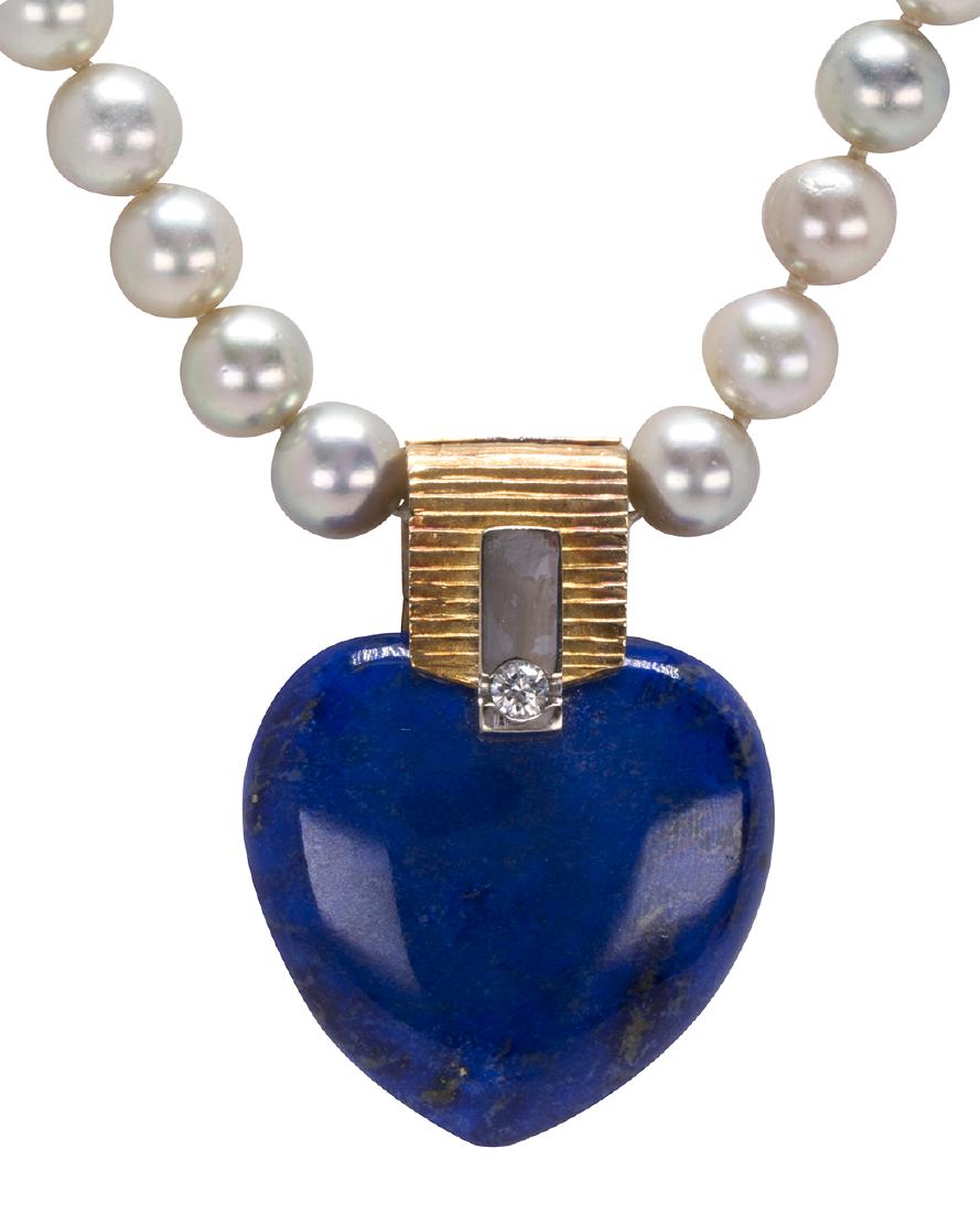 Ole Lynggaard lapis lazuli, diamond, cultured and 18k: Ole Lynggaard lapis lazuli, diamond, cultured and 18k yellow gold heart convertible necklace Featuring (1) carved lapis lazuli heart, measuring approximately 25 X 25 X 9 mm, accented by (1) full-cut d