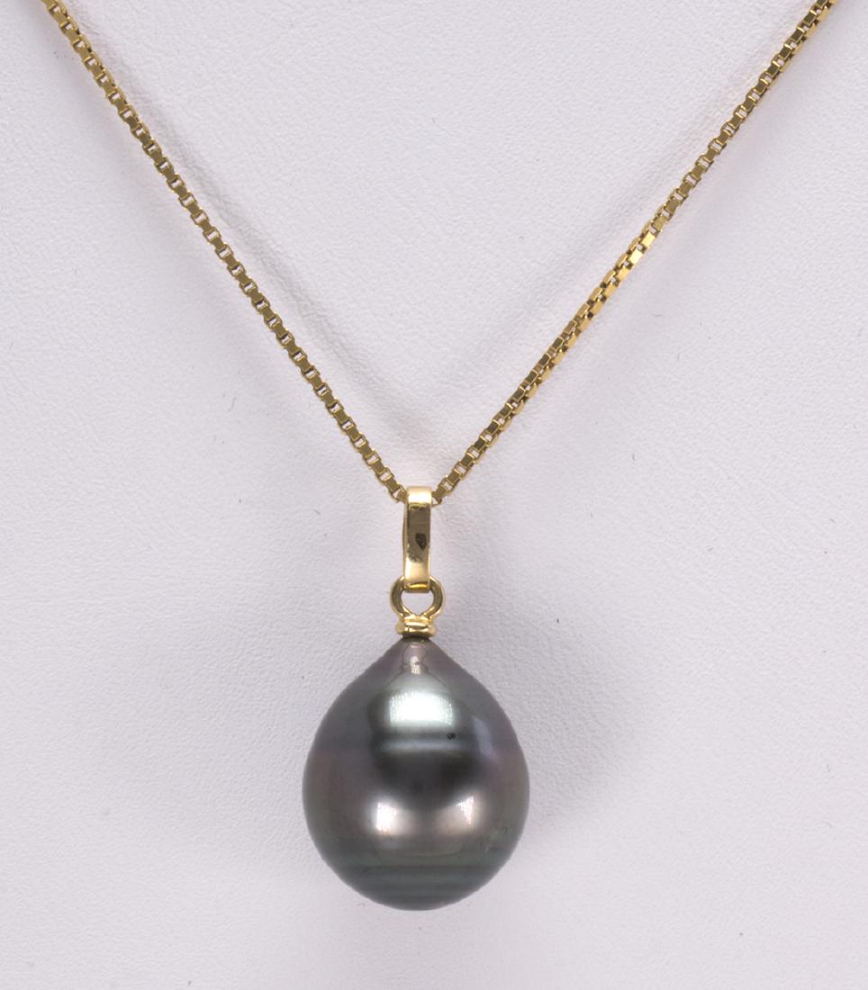 Tahitian cultured pearl and yellow gold: Tahitian cultured pearl and yellow gold pendant-necklace featuring (1) grey cultured pearl drop, measuring approximately 17 X 13 mm, set with an 18k yellow gold bail, suspended from a 14k yellow gold,