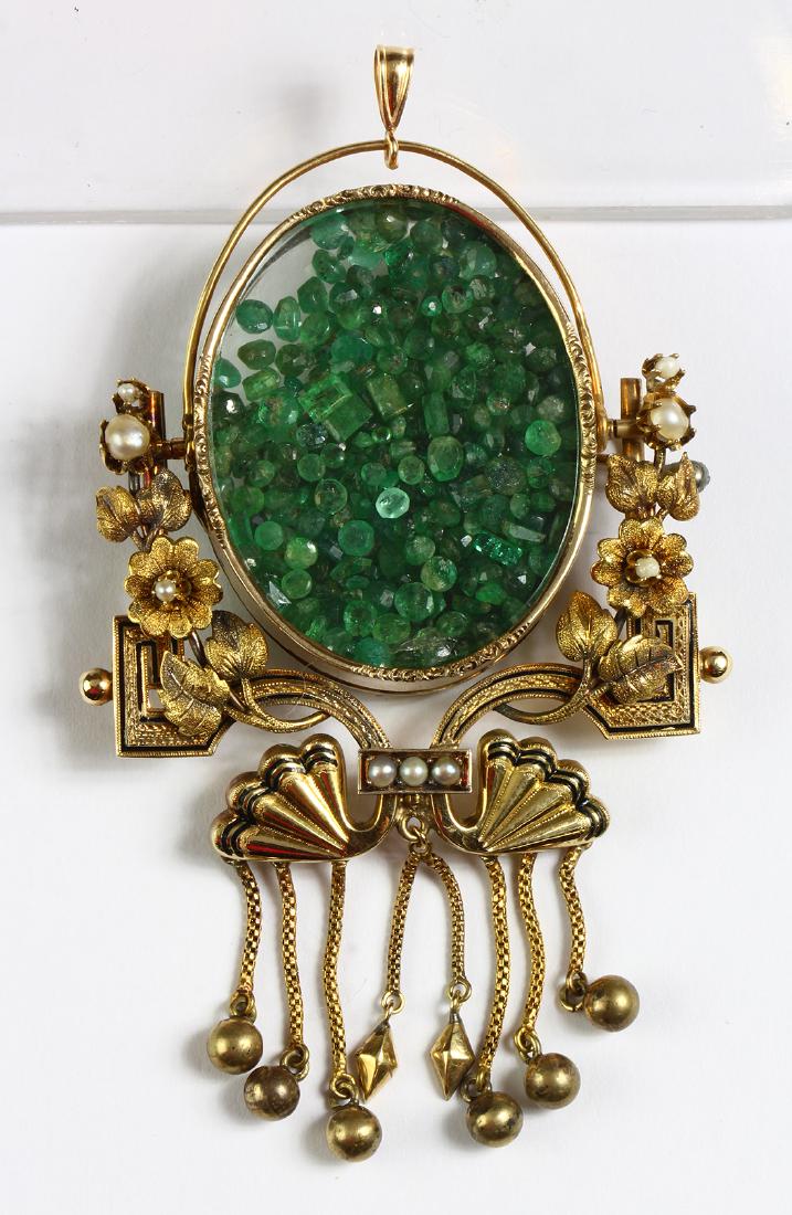 Enamel, pearl, emerald and 14k yellow gold: Enamel, pearl, emerald and 14k yellow gold pendant-brooch Designed with fans, flower garlands and tassels, accented by black enamel tracery, featuring a locket compartment containing numerous unmounte