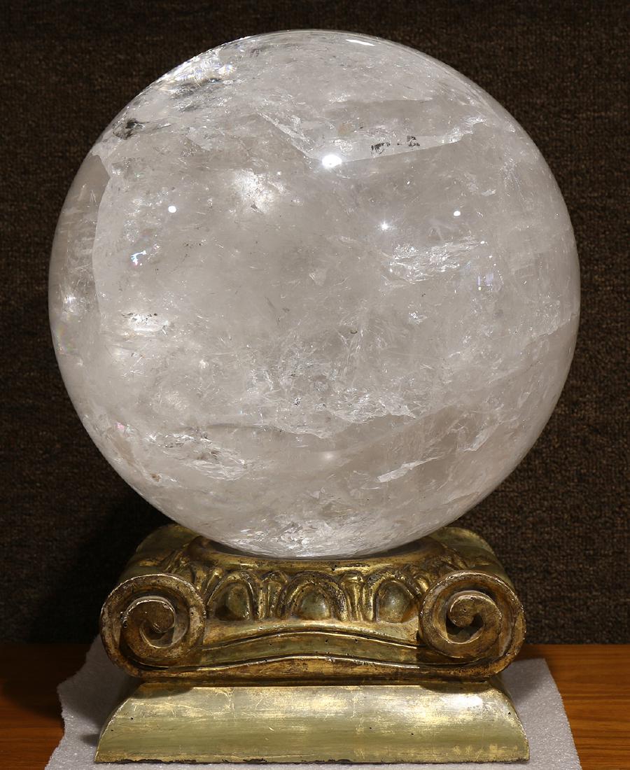 Large crystal sphere, rising on a gilt stand, in the (1 of 2)