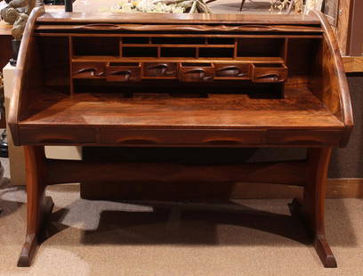 American studio furniture roll top desk: American studio furniture roll top desk, attributed to Michael Coffey, having a rectangular top, above a sculpted tambour door with contoured designs, opening to a fitted interior, above the three dra