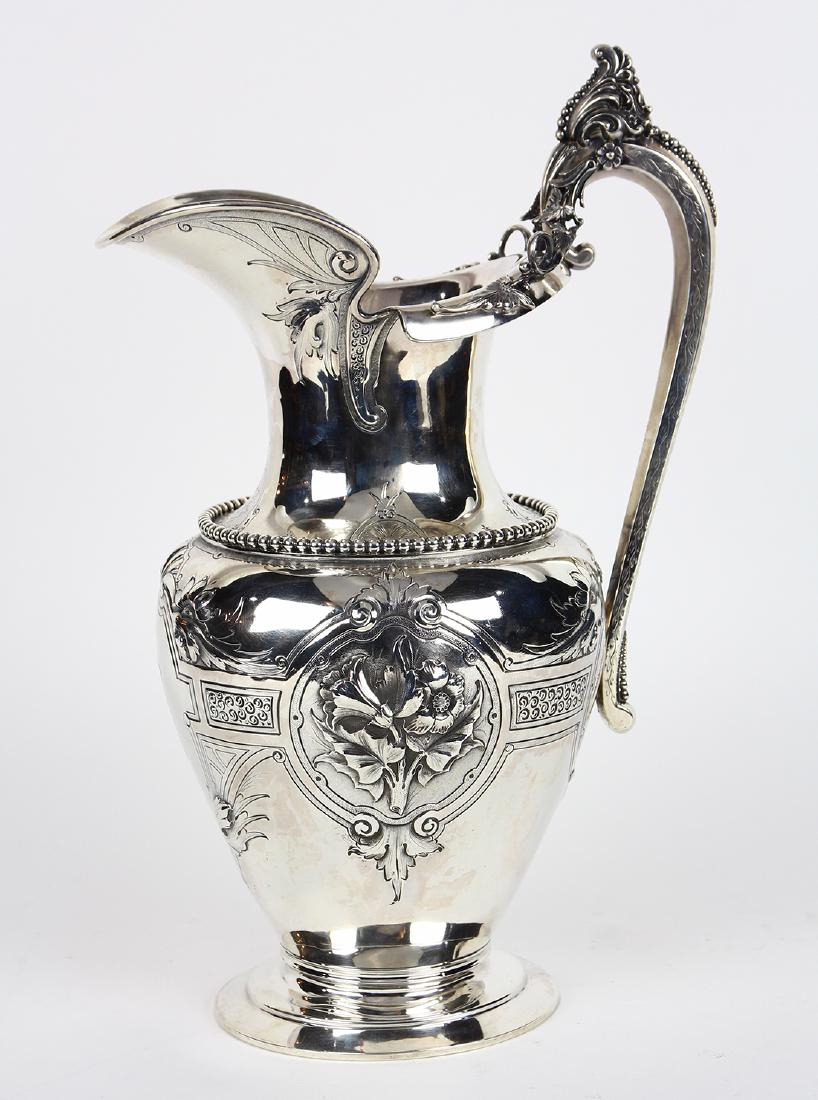 American coin silver pitcher, circa 1870, by George: American coin silver pitcher, circa 1870, by George Sharp for Bailey & Co. Philadelphia, having a tapering baluster form, the handle elaborately decorated with bead and scroll work, continuing to repo