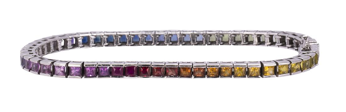 Multi-colored sapphire, 14k yellow gold bracelet: Multi-colored sapphire, 14k yellow gold bracelet Featuring (55) French-cut multi-colored sapphires, weighing a total of approximately 11.75 cts., set in a 14k white gold articulated, straight line lin