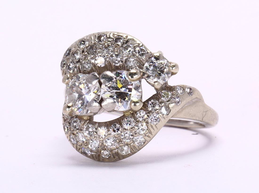 Diamond and 18k white gold ring: Diamond and 18k white gold ring Featuring (2) old-cut diamonds, weighing approximately 0.60 ct., (both are chipped), accented by (27) single-cut diamonds, weighing a total of approximately 0.25 ct., s
