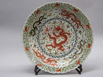 Massive Chinese charger with dragon: Massive Chinese polychrome decorated charger centered by a dragon, underside with apocryphal Wanli mark, 21" diameter